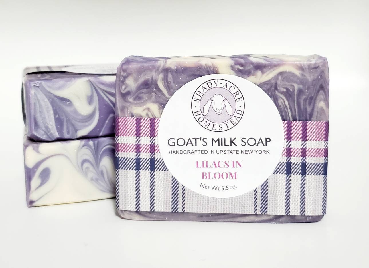 Lilacs in Bloom goat's milk soap with purple marbled design and plaid packaging