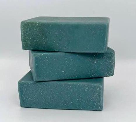 Blue Spruce scented goat milk soap bar. Blueish green in color.